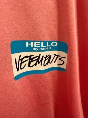 Vetements Pink Tee with Blue & White Name-Tag Graphic
